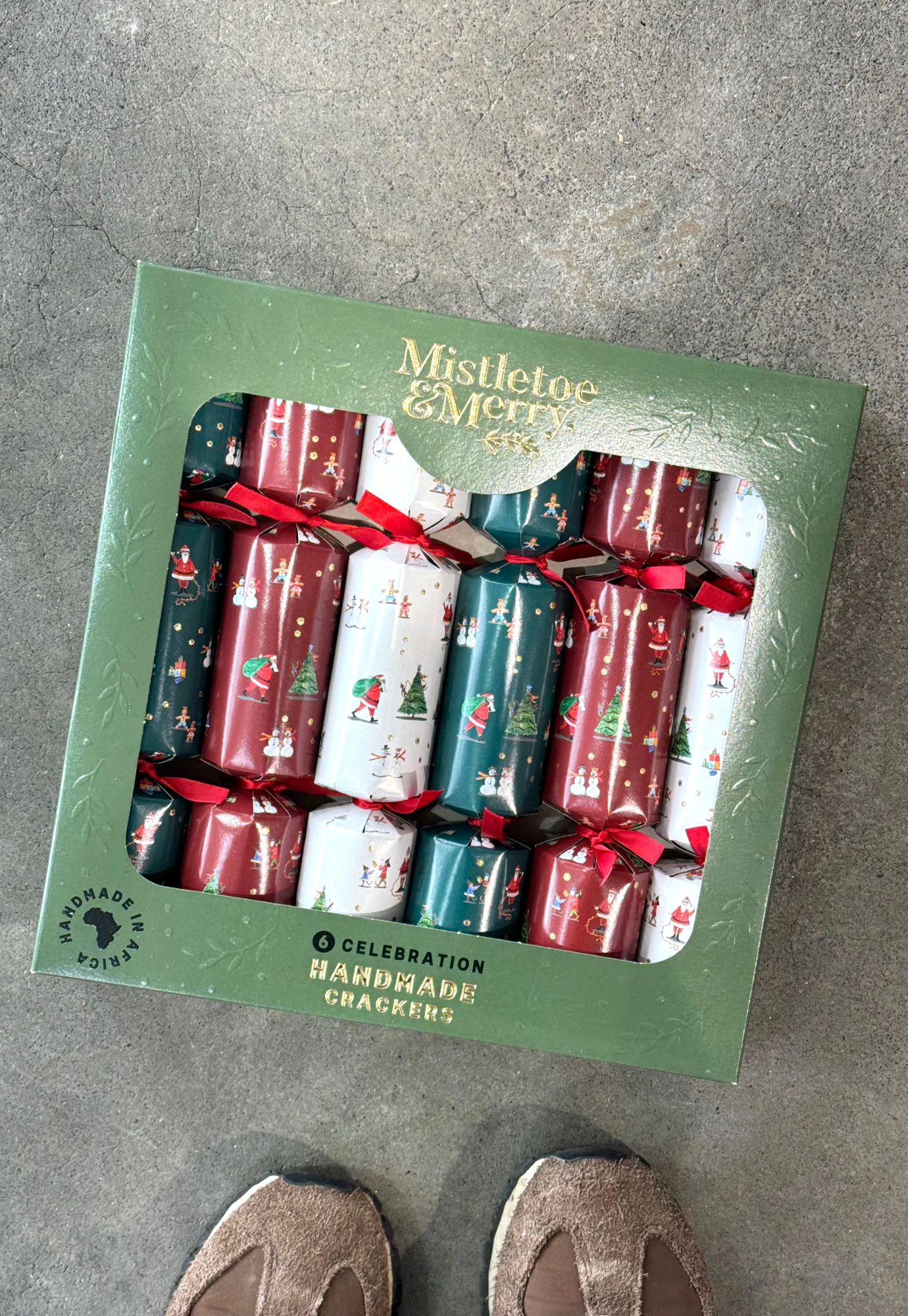 front view of mistletoe merry mini santa friends christmas crackers set of six in red green and white