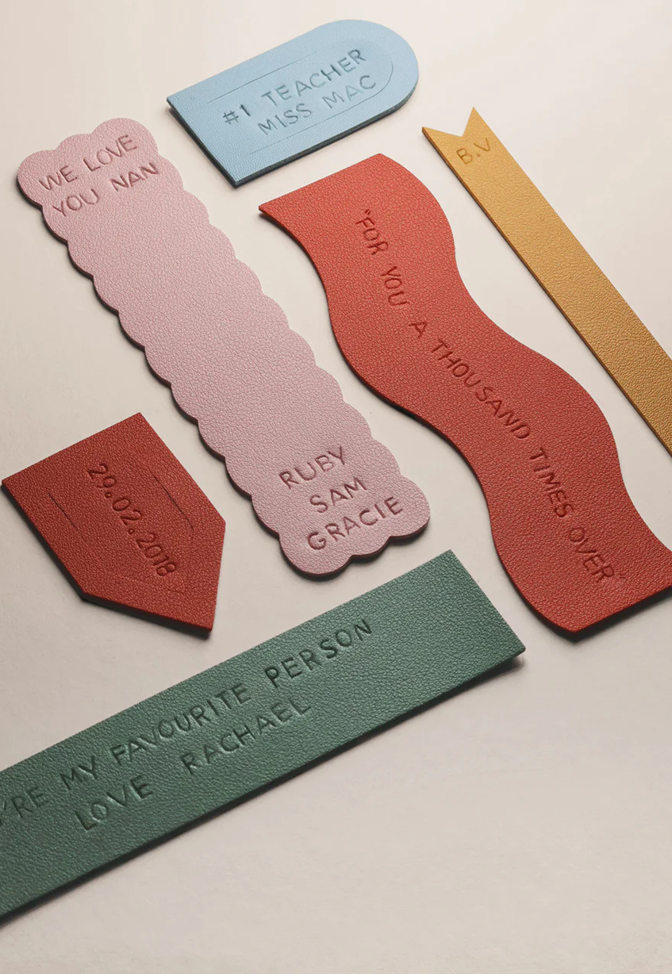 finished bookmarks from personalised bookmarks kit displayed in a holder showing stamped names and quotes