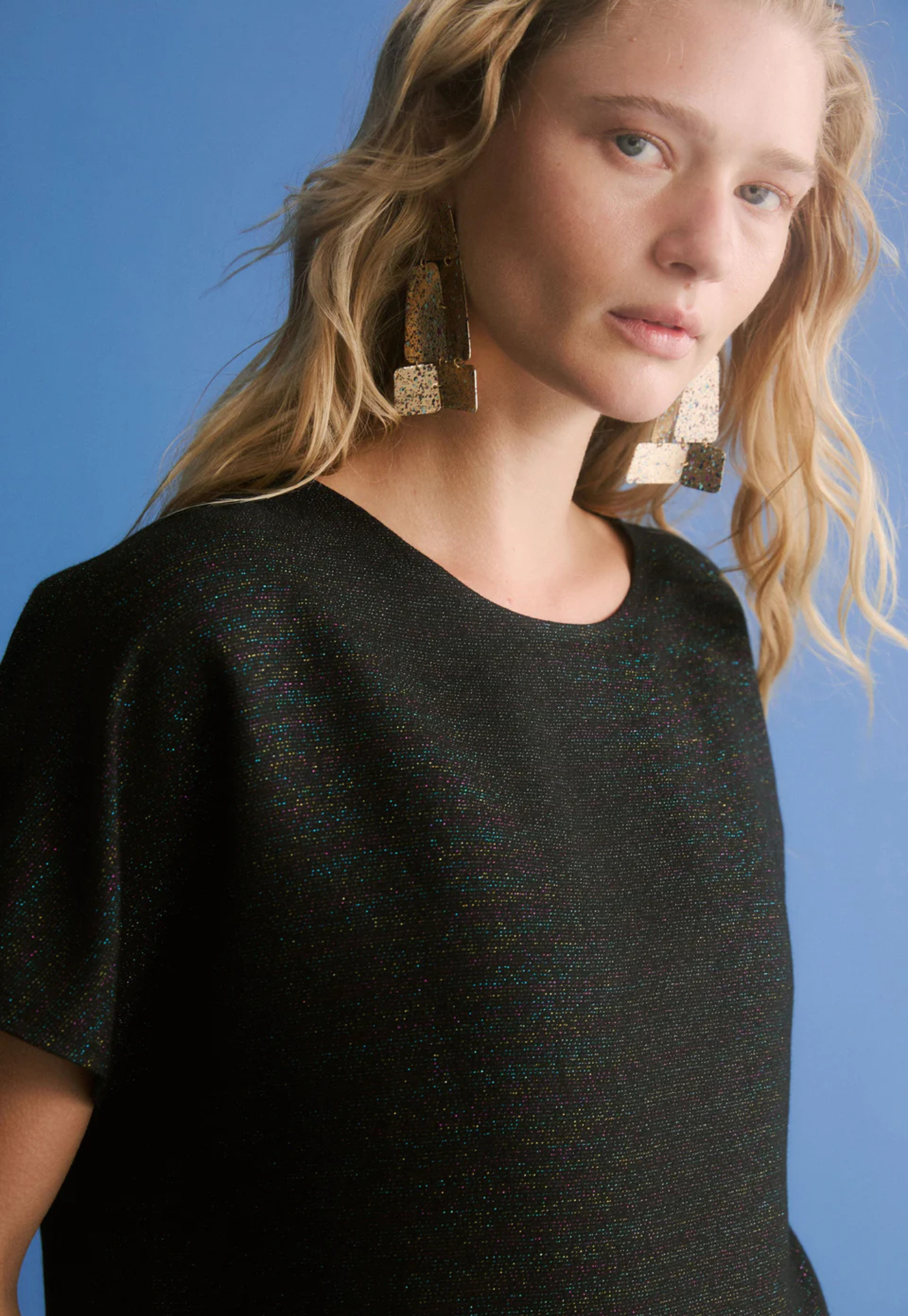 close up of elk tulle top fabric highlighting lurex thread and subtle sheen