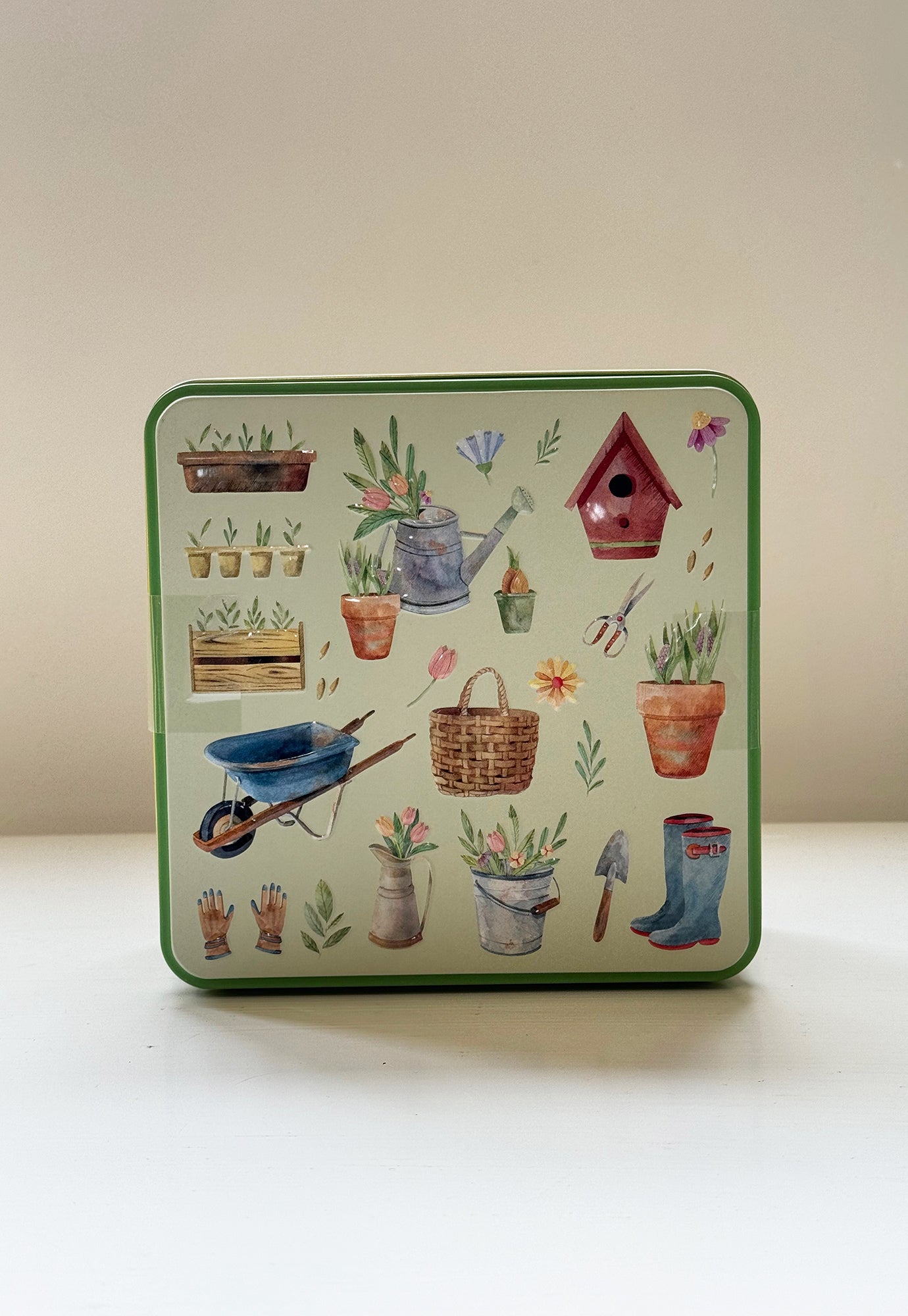 pottering garden embossed biscuit tin