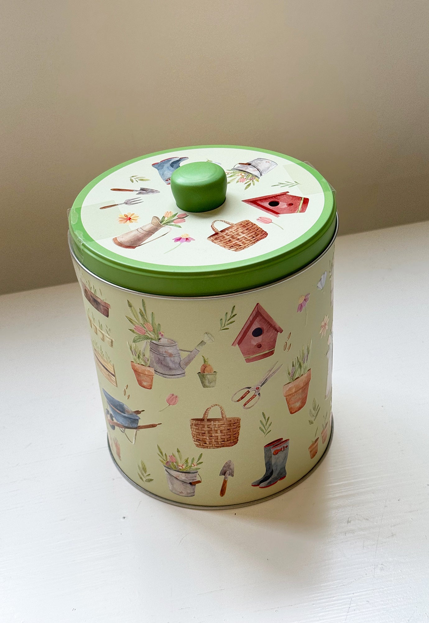 pottering garden round biscuit tin