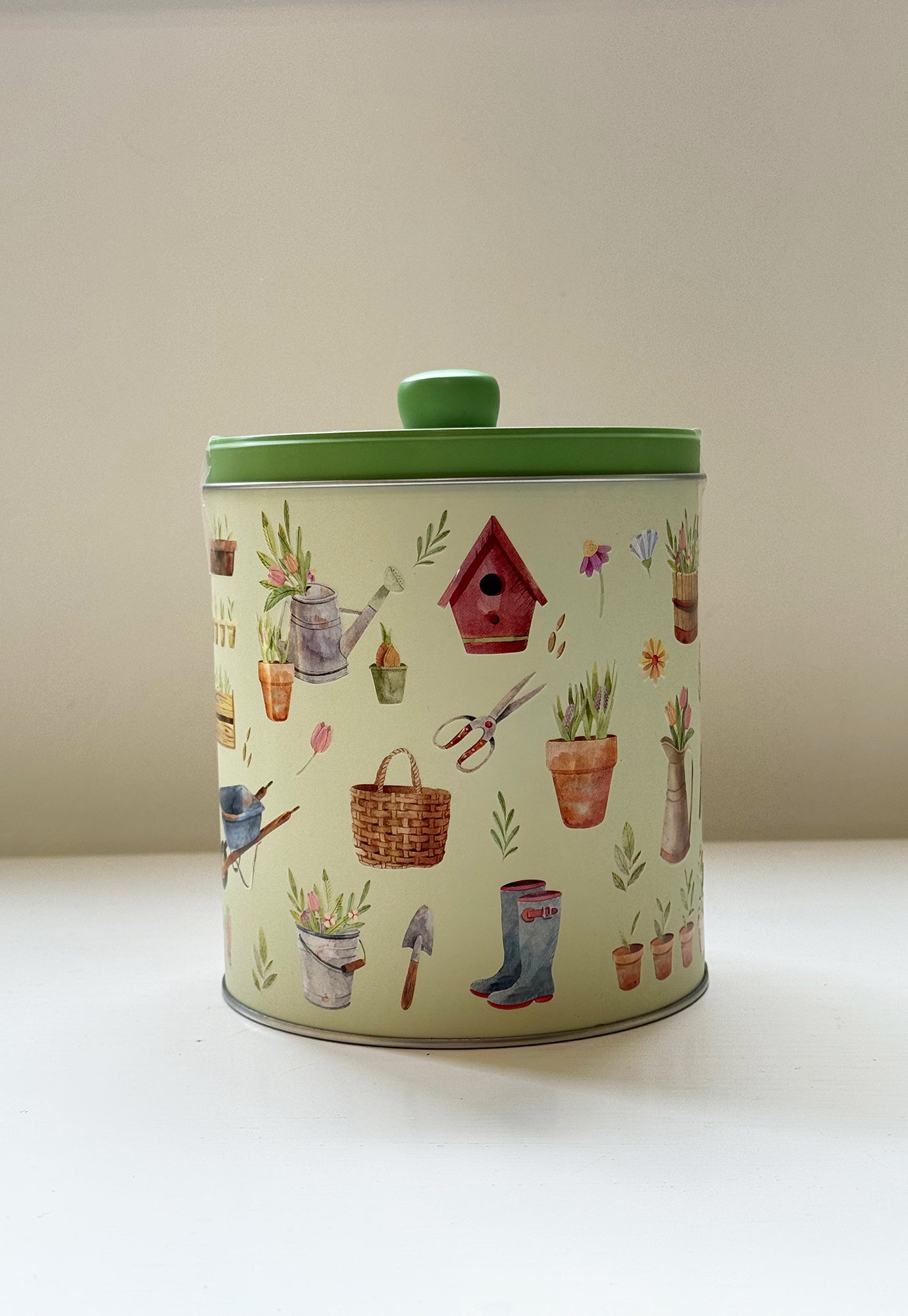 pottering garden round biscuit tin