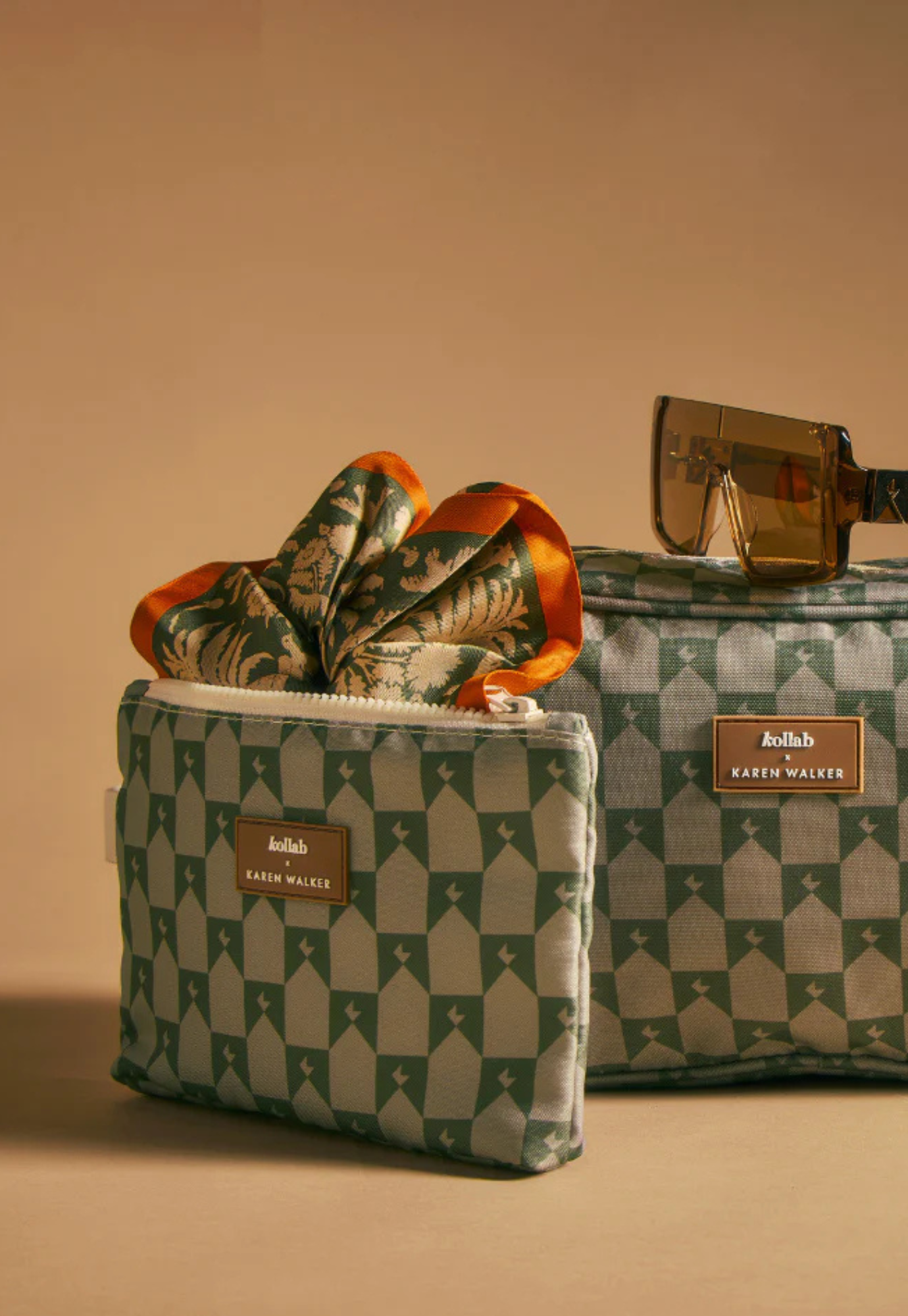 front view of mini pouch kollab x karen walker sage monogram showing compact shape and monogram print