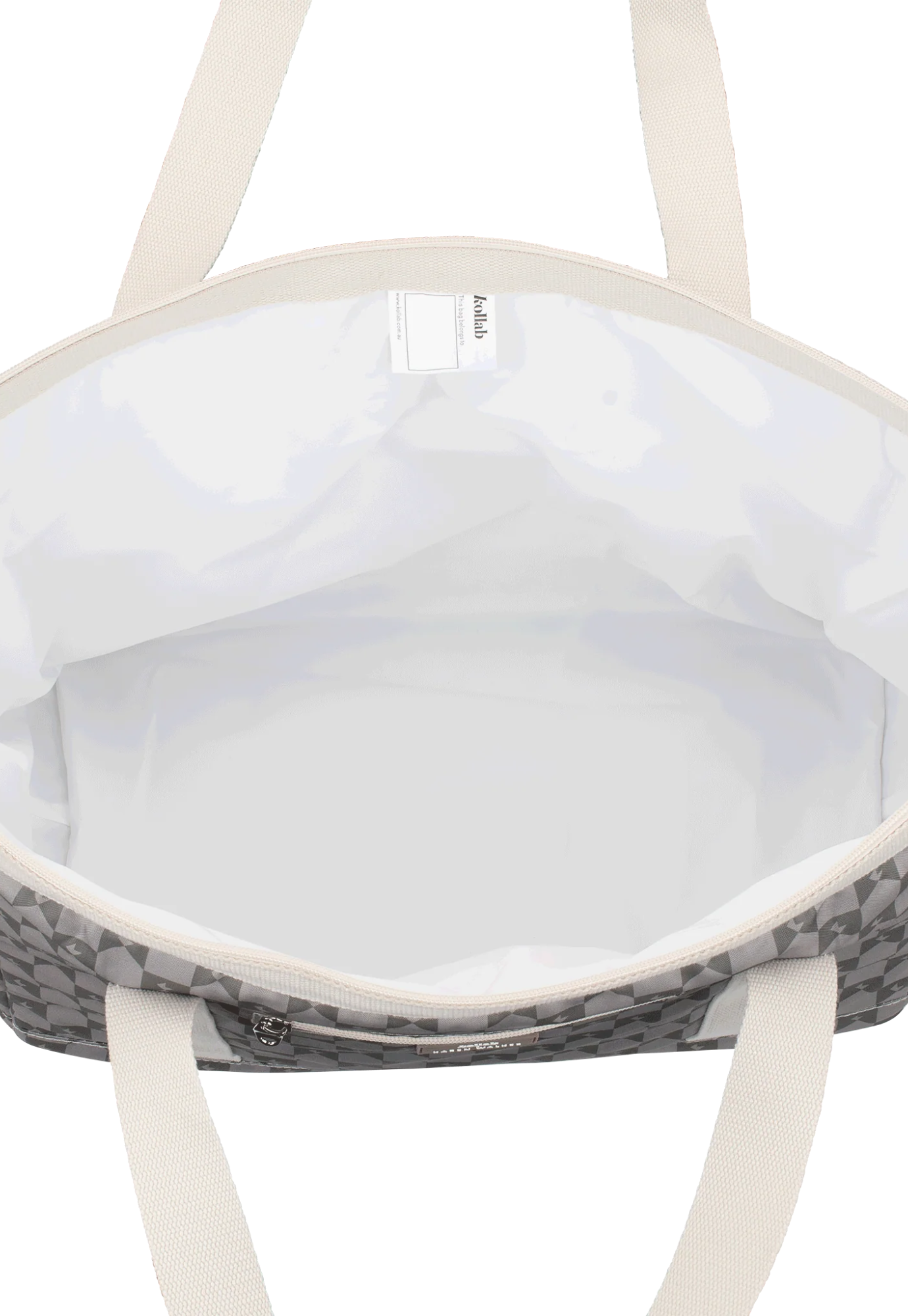 open view of tote bag kollab x karen walker sage monogram revealing top zip closure and roomy interior